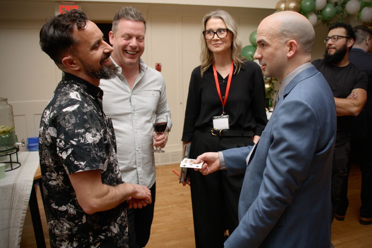 Geo surprises a small group of guests at a fundraising event with close-up magic